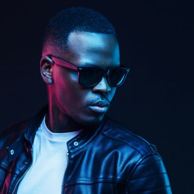 African man neon portrait, wearing trendy sunglasses and leather jacket